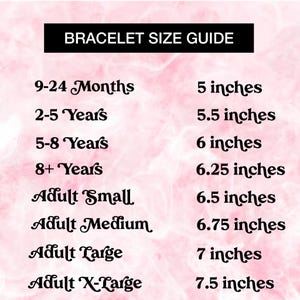May include: A bracelet size guide chart with black text on a light pink background. The chart lists sizes from 9-24 Months at 5 inches up to Adult X-Large at 7.5 inches, providing specific measurements in inches for various age groups and adult sizes.