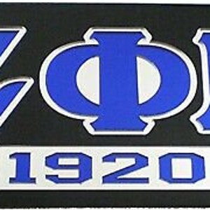 May include: Black license plate with blue and silver lettering. The letters ZOB and the number 1920 are visible.