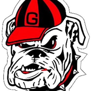 May include: A black and white bulldog mascot wearing a red and black baseball cap with a white "G" on the front.