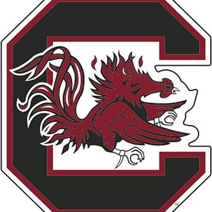 May include: A white and red rooster mascot with a black outline, inside a black and maroon letter "C" with a white outline. The mascot is facing the right side of the image. The letter "C" is in a white octagon shape with a black and maroon border.