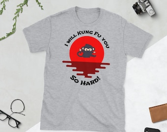 May include: A gray t-shirt with a black and white graphic of a monkey doing kung fu in front of a red sun. The text on the shirt reads "I will kung fu you so hard!"