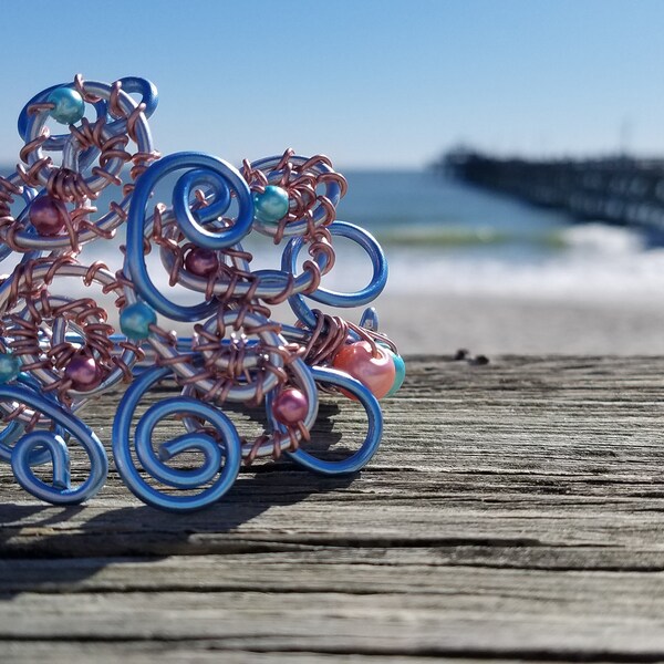 Blue and coral spiral bracelet