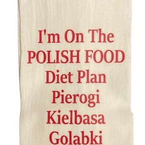 May include: A white kitchen towel with red text that reads "I'm on the Polish Food Diet Plan" and lists Polish foods: Pierogi, Kielbasa, Golabki, Kapusta.