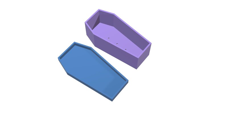 A light purple coffin-shaped planter box is shown with its light blue lid slightly ajar, both pieces viewed from above.