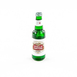 May include: A miniature green glass bottle of Stella Artois beer with a silver cap. The bottle has a white label with the Stella Artois logo and the word "LEGERE" printed on it. The bottle is a small size.