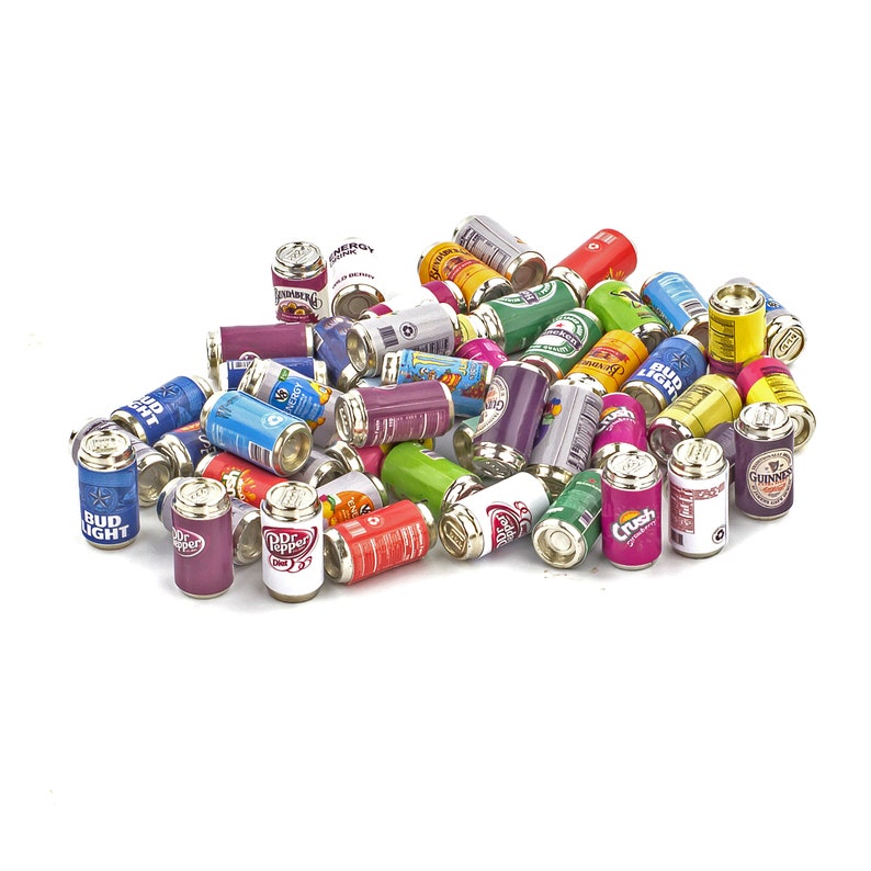 May include: A collection of miniature aluminum cans featuring various popular beverage brands, including Bud Light, Dr Pepper, Crush, and Guinness. The cans are arranged in a pile on a white background.
