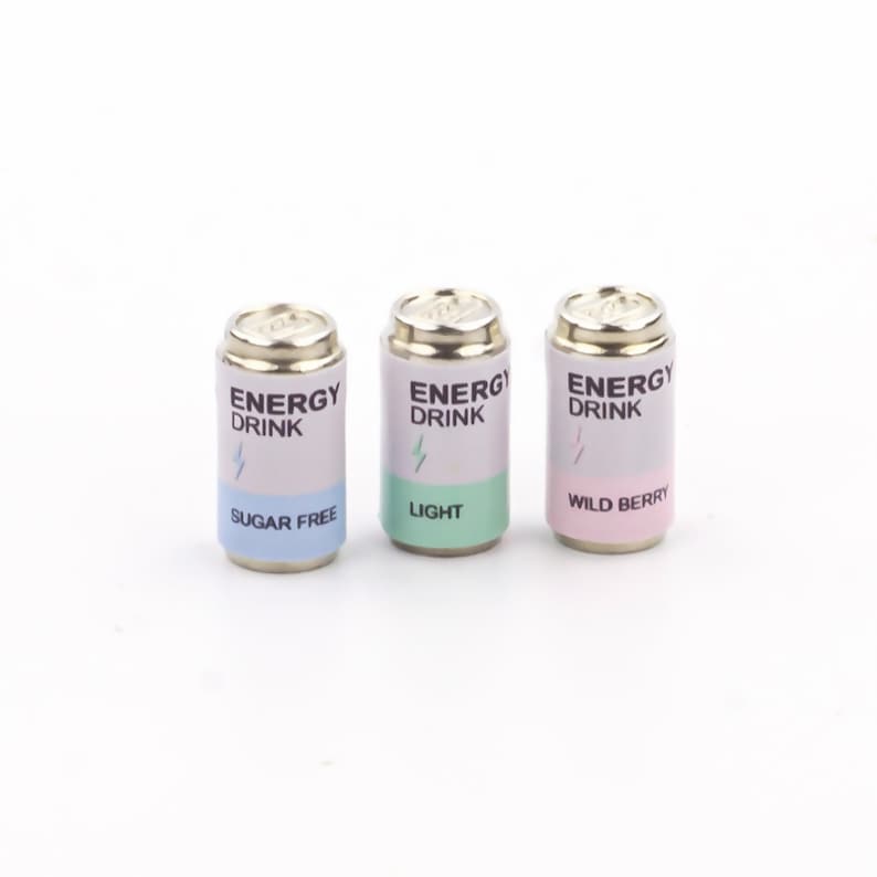 May include: Three silver energy drink cans with different flavors: Sugar Free, Light, and Wild Berry. Each can has a white label with black text and a lightning bolt graphic.