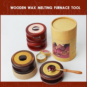May include: Wooden wax melting furnace tool with three different sizes of round wooden bases, a small tin of wax, a spoon, and a cylindrical box with a wax seal design.