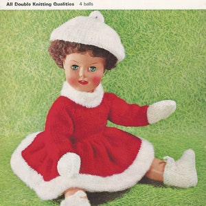 May include: A vintage doll wearing a red knitted dress with white trim, matching mittens, a beret, and booties. The doll has brown hair and is sitting on a green background. The image is from a "Lee Target" knitting pattern.