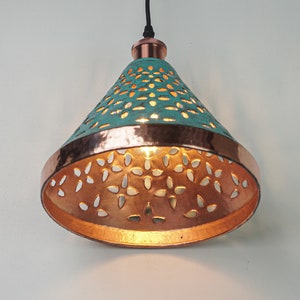 Image of cone copper lights combining hand-carved cut-out pattern with green patina finish and small strip of hand-hammered pattern with polished copper finish, with natural copper finish interior.