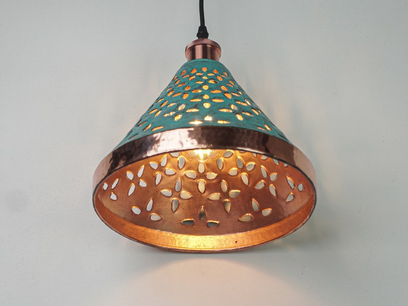 Image of cone copper lights combining hand-carved cut-out pattern with green patina finish and small strip of hand-hammered pattern with polished copper finish, with natural copper finish interior.