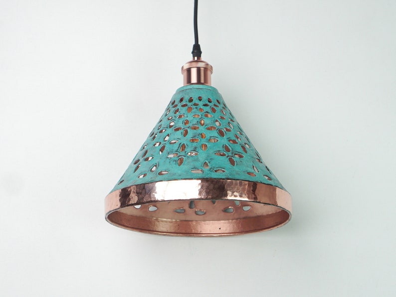 Image of cone copper lights combining hand-carved cut-out pattern with green patina finish and small strip of hand-hammered pattern with polished copper finish, with natural copper finish interior.