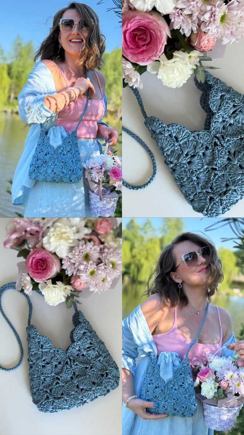 May include: A slate blue crochet handbag featuring a repeating scalloped shell pattern throughout the body. The bag includes a matching thin braided shoulder strap and a structured open top design with a textured, woven appearance.
