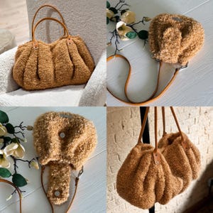 May include: A tan, textured, fuzzy fleece handbag featuring a pleated design, two thin leather-like shoulder straps attached with metal rivets, and a magnetic snap closure. The bag has a soft, curly exterior and a structured, rounded shape.