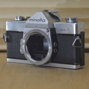 Classic Stylish Minolta SR1 50s SLR 35mm camera (Body only). These are very solid and striking vintage cameras. Would be a lovely gift
