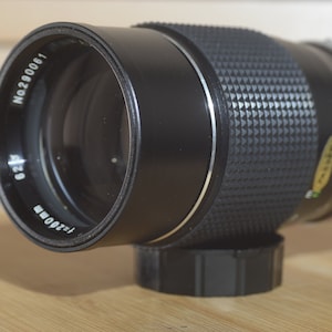 Soligor Auto MC 200mm f3.5 FD lens.  In excellent condition. These are lovely lenses that produce fantastic images