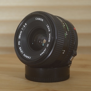Canon FD 28mm f2.8 lens. This is a fantastic wide angle lens in superb condition!