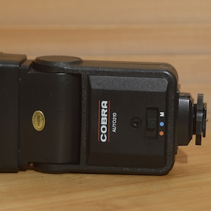 Boxed Universal Cobra Auto210 flash unit  - compatible with Canon, Nikon, Olympus, Pentax.