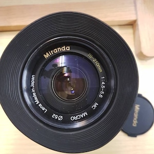 Miranda 70-210 Canon FD fit zoom lens. Lovely light and bright vintage lens with a really useful range. This is perfect Canon A series.