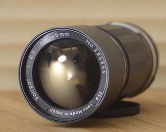 Gorgeous 200mm f4.5 M42 fit lens by Soligor with hard case.  This is a magnificent lens for your existing M42 lens fit Camera.