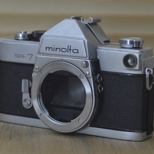Gorgeous Minolta SR7 60s SLR (Body only). These are very solid and striking vintage cameras. Would be a lovely gift for Loved ones!