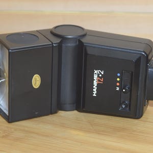 Hanimex TZ2 Flash Unit, multi dedicated tilt and defuse settings.  With auto auto mode and manual settings.
