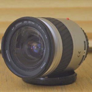 Lovely Minolta AF 28-80mm f3.5- 5.6 lens. Auto focus with macro. Perfect for Minolta 35mm or digital AF fit.