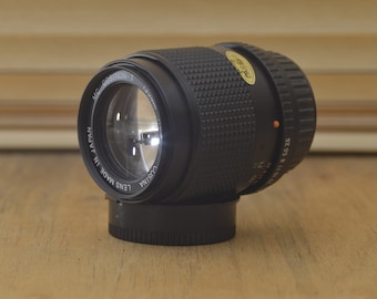 Super Sharp Cosina PK mount 135mm 3.5 lens with case.  This is a beautiful lens especially for portraiture work.