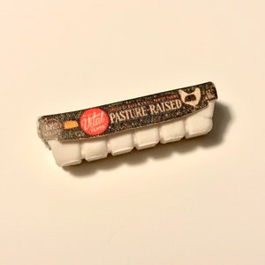 May include: A white egg carton with a black and white label that says "Vital Farms Pasture-Raised" in red letters.