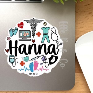 May include: A round sticker with a white background and colorful medical illustrations. The sticker features the name "Hanna" in a pink and blue font. The sticker is 3 inches in diameter.