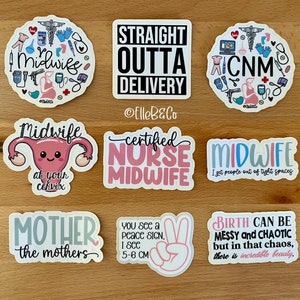 May include: A set of ten stickers featuring various designs related to midwifery. The stickers are printed on white backgrounds with black, pink, blue, and green lettering. Some of the stickers feature illustrations of a uterus, a peace sign, and medical tools. The text on the stickers includes phrases like "Midwife", "Certified Nurse Midwife", "Straight Outta Delivery", and "Birth Can Be Messy and Chaotic, But in That Chaos, There is Incredible Beauty."