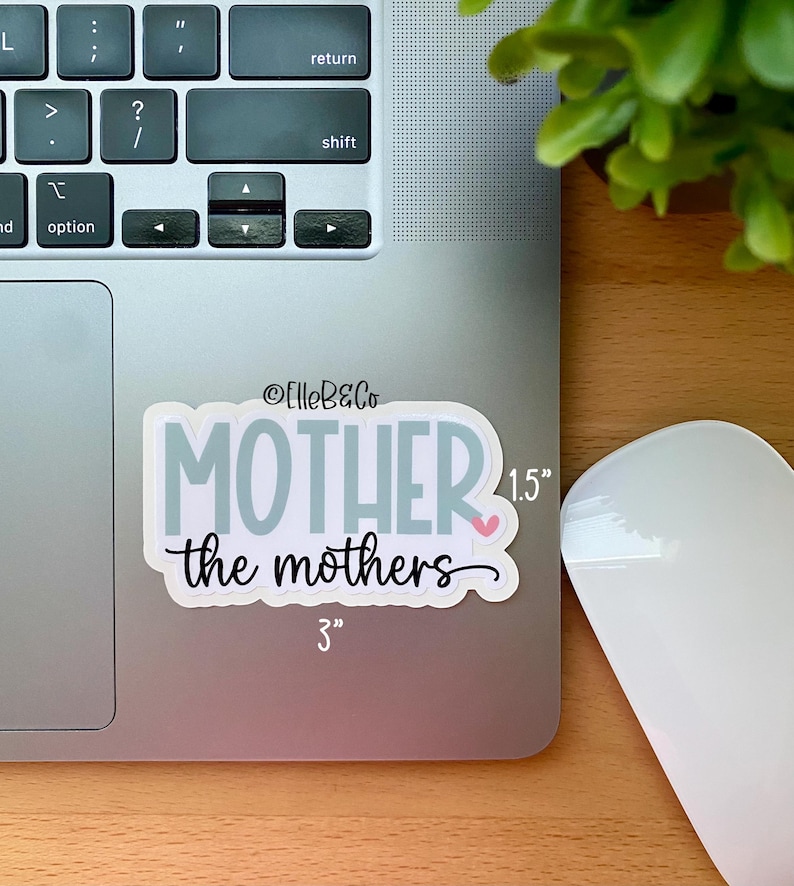 May include: A white sticker with the text "MOTHER the mothers" in blue and black lettering. The sticker is 3 inches wide and 1.5 inches tall.