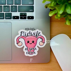 May include: A pink cartoon uterus with a smiling face and the text "Midwife at your cervix" on a white background. The sticker is 3 inches wide and 2.5 inches tall.