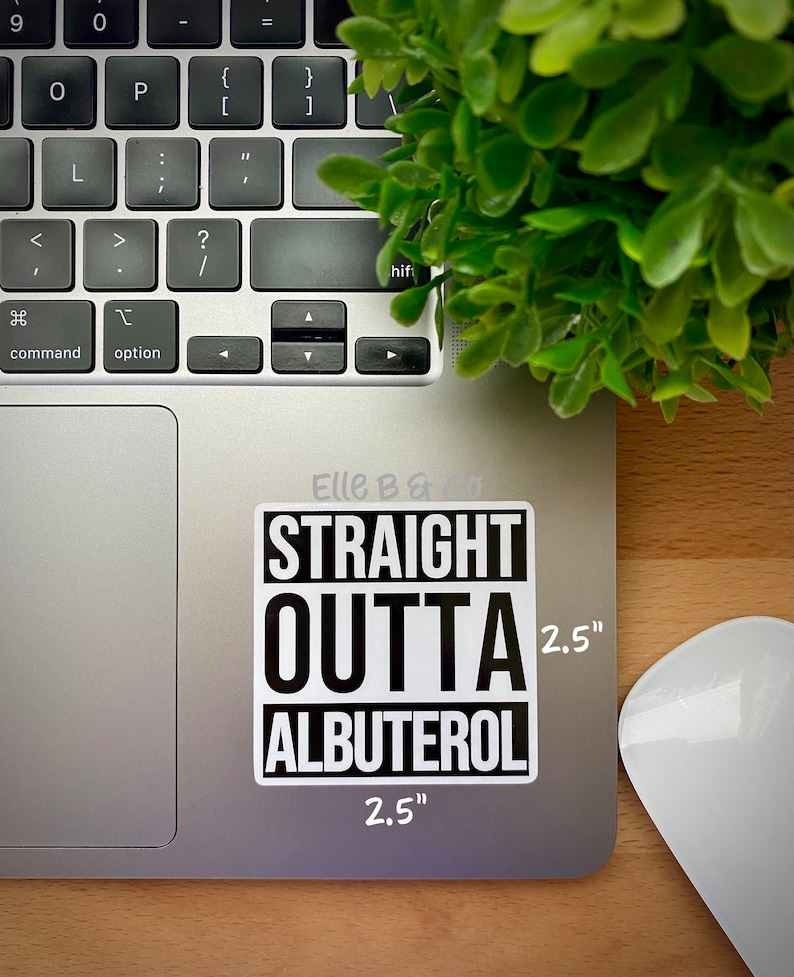 May include: A black and white sticker with the text "STRAIGHT OUTTA ALBUTEROL" in a bold font. The sticker is 2.5 inches wide and 2.5 inches tall. It is placed on a silver laptop.
