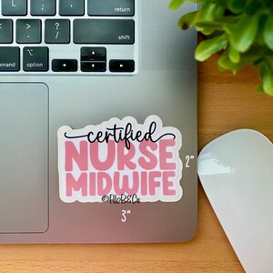 May include: A pink and black sticker with the text "certified NURSE MIDWIFE" and the social media handle "@ElleB&Co". The sticker is 3 inches wide and 2 inches tall.