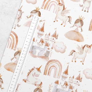 May include: A seamless pattern featuring a whimsical unicorn, a princess, a castle, and a rainbow. The design is in a watercolor style with soft pink, brown, and gold tones on a white background.