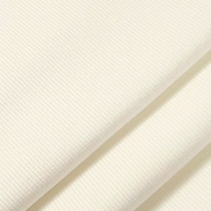 May include: White ribbed fabric with a smooth texture. The fabric is folded in half, showing the inside and outside of the material.