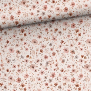 Könnte beinhalten: Stoff mit einem zarten Muster aus kleinen, aquarellartigen Blumen in Rosa-, Pfirsich- und Brauntönen. Die Blumen sind auf einem cremefarbenen Hintergrund verteilt und erzeugen eine weiche, feminine Ästhetik. Geeignet für Nähprojekte.