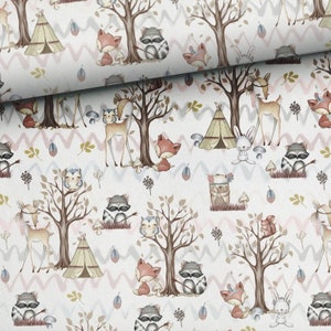 May include: A white fabric with a repeating pattern of woodland animals, trees, and teepees. The design features foxes, raccoons, deer, owls, and rabbits in a whimsical forest scene. The background has a zig-zag pattern in soft pink, blue, and gray.