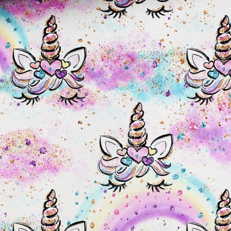 May include: A white background with a repeating pattern of unicorn faces with gold glitter horns and eyelashes. The unicorns have pink, blue, and purple watercolour accents and hearts around their eyes.