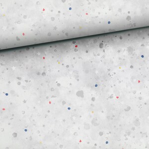 May include: White fabric with a scattered pattern of small blue, red, and yellow dots and white stars.