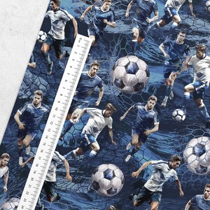 May include: A seamless fabric pattern featuring a blue and white soccer theme. The pattern includes multiple soccer players in blue and white uniforms, along with soccer balls, and a blue and white net.