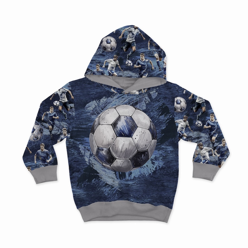 May include: A blue hooded sweatshirt with a soccer ball and soccer players printed on it. The hoodie has a grey interior.