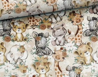 May include: A patterned fabric featuring cartoon safari animals such as giraffes, zebras, lions, elephants, and hippos. The animals are adorned with floral details and set against a cream backdrop with white and yellow flowers.