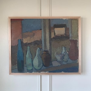 May include: An abstract painting in a light wood frame. The artwork depicts a still life of bottles and vases in shades of blue, green, brown, and red. The background suggests a window view with muted colors.