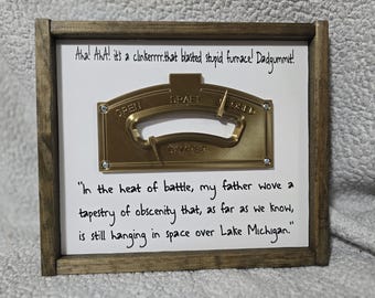A Christmas Story Furnace Damper Wood Sign, "It's A Clinker" in the heat of battle