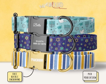 May include: Three pet collars with side-release buckles. The top collar is light blue with menorahs, doves, and stars of David, featuring a black buckle engraved with Bella. The middle is dark blue with stars of David, featuring a black buckle engraved with SHASTA 888-321-9876. The bottom is blue, white, and yellow striped with a gold buckle engraved with TUCKER.