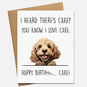 May include: A greeting card with a brown envelope. The card features a smiling, light brown dog and the text "I HEARD THERE'S CAKE? YOU KNOW I LOVE CAKE. HAPPY BIRTHMMMM... CAKE!"