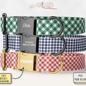 May include: Three pet collars with gingham patterns in green, navy blue, and red. Each collar features a side-release buckle with custom engraving. The top buckle is black with the name Bella, the middle is black with Shasta and 888-321-9876, and the bottom is gold with Tucker.