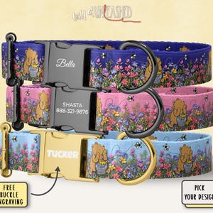 May include: Three dog collars stacked on top of each other. The collars are blue, pink, and light blue, each with a floral pattern and a cartoon bear. The collars have personalized nameplates and buckles. The text "Free Buckle Engraving" and "Pick Your Design" are also visible.